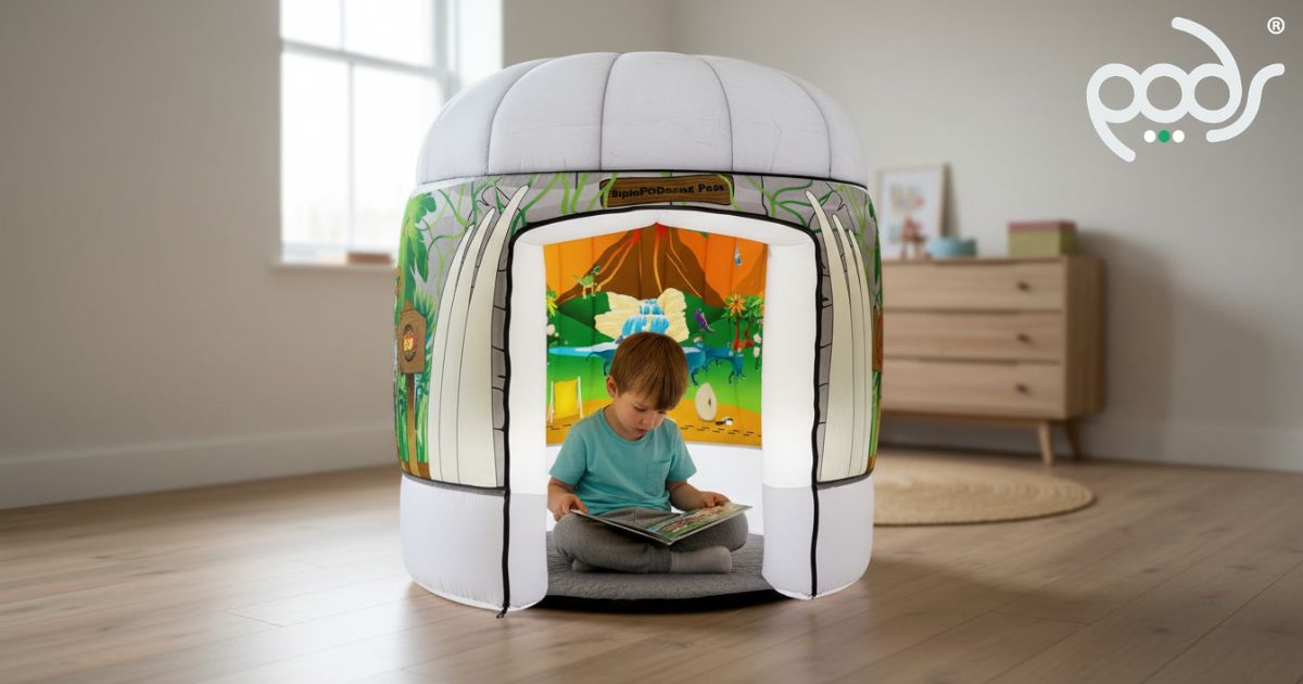 Child enjoying quiet reading inside a Walking With Dinosaurs PODSmini sensory play tent.