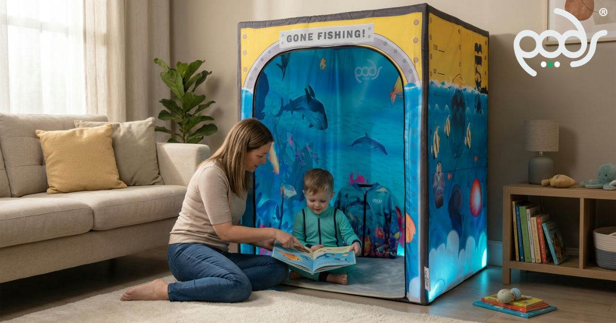 Child exploring ocean-themed learning and reading inside a PODSgo Sub Aqua indoor play tent.