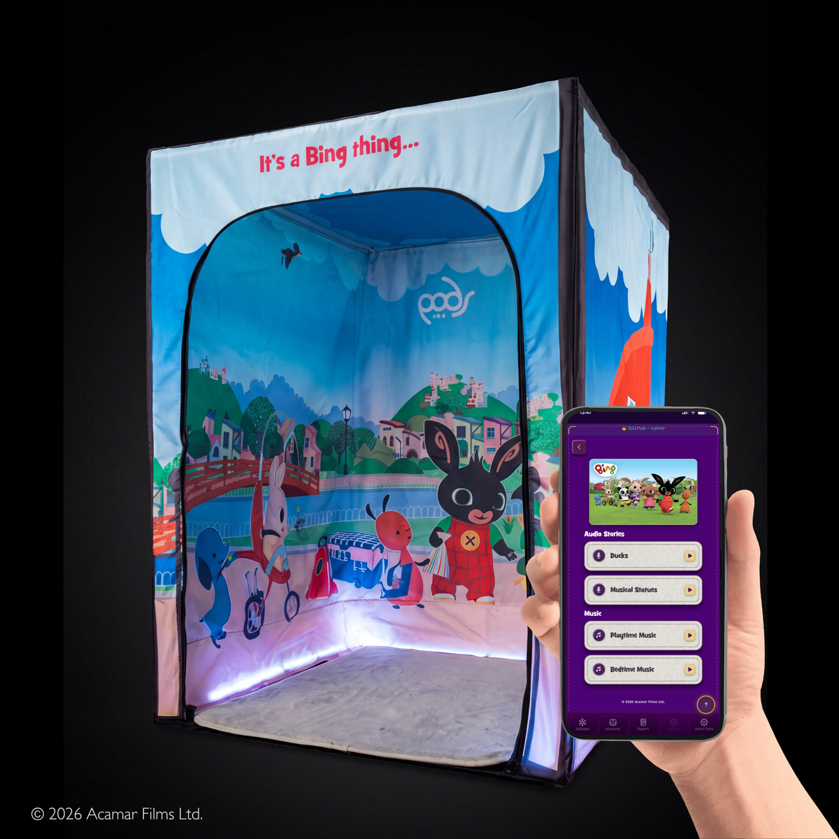 PODSgo Bing with the door off, showing the park inside, and the PODS Play app open on a phone
